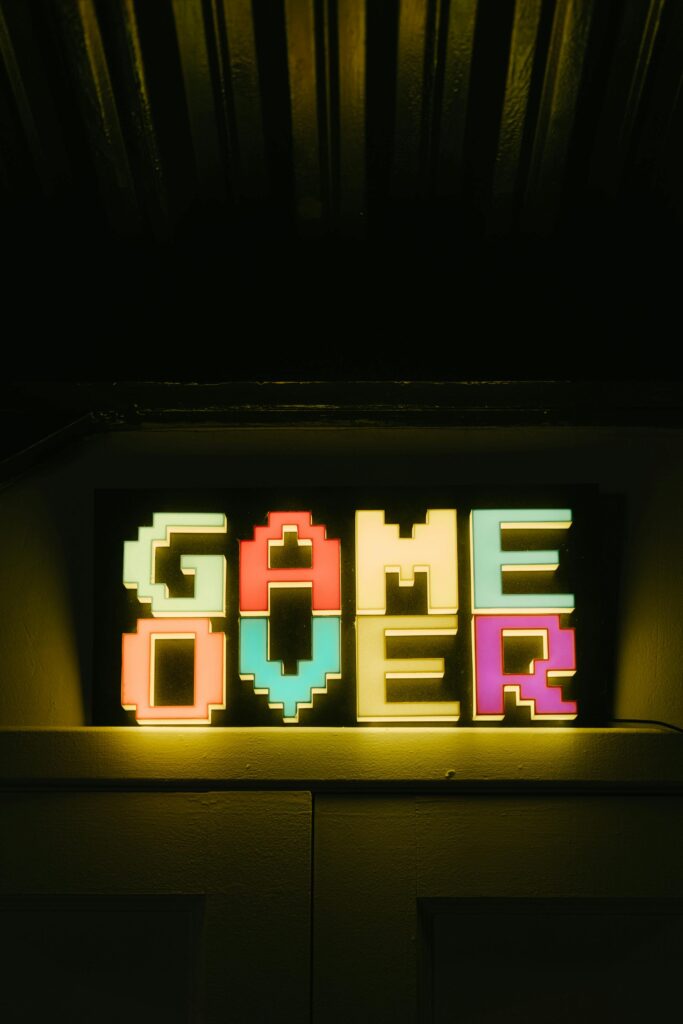 Bright neon 'Game Over' sign in retro style, perfect for gaming nostalgia